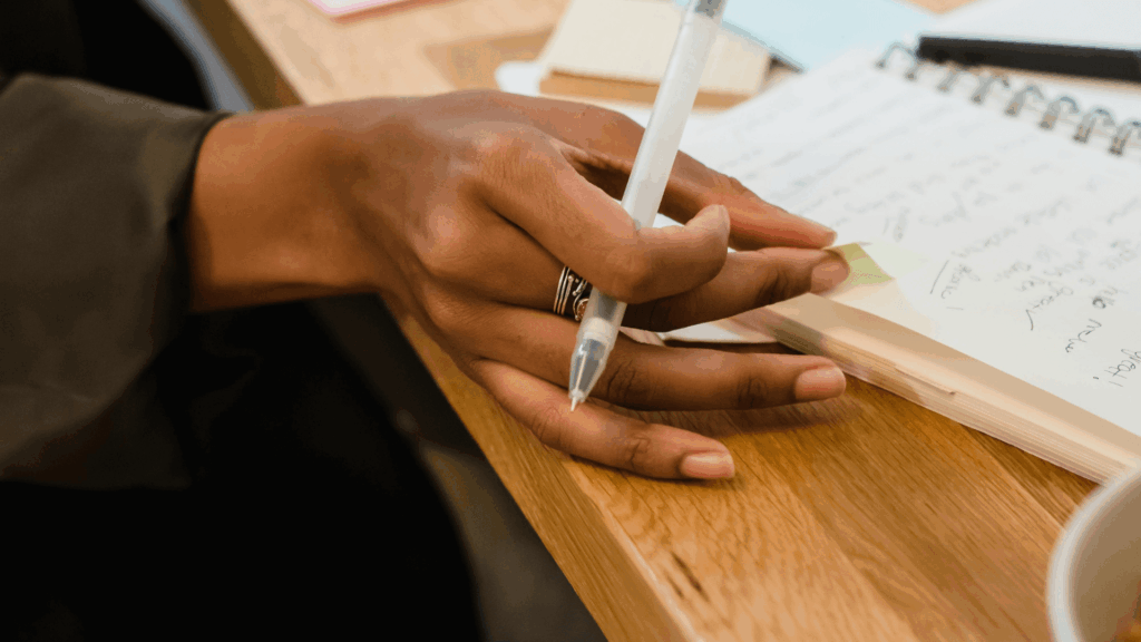 Creative entrepreneur planning workflows systems and SOPs in a notebook