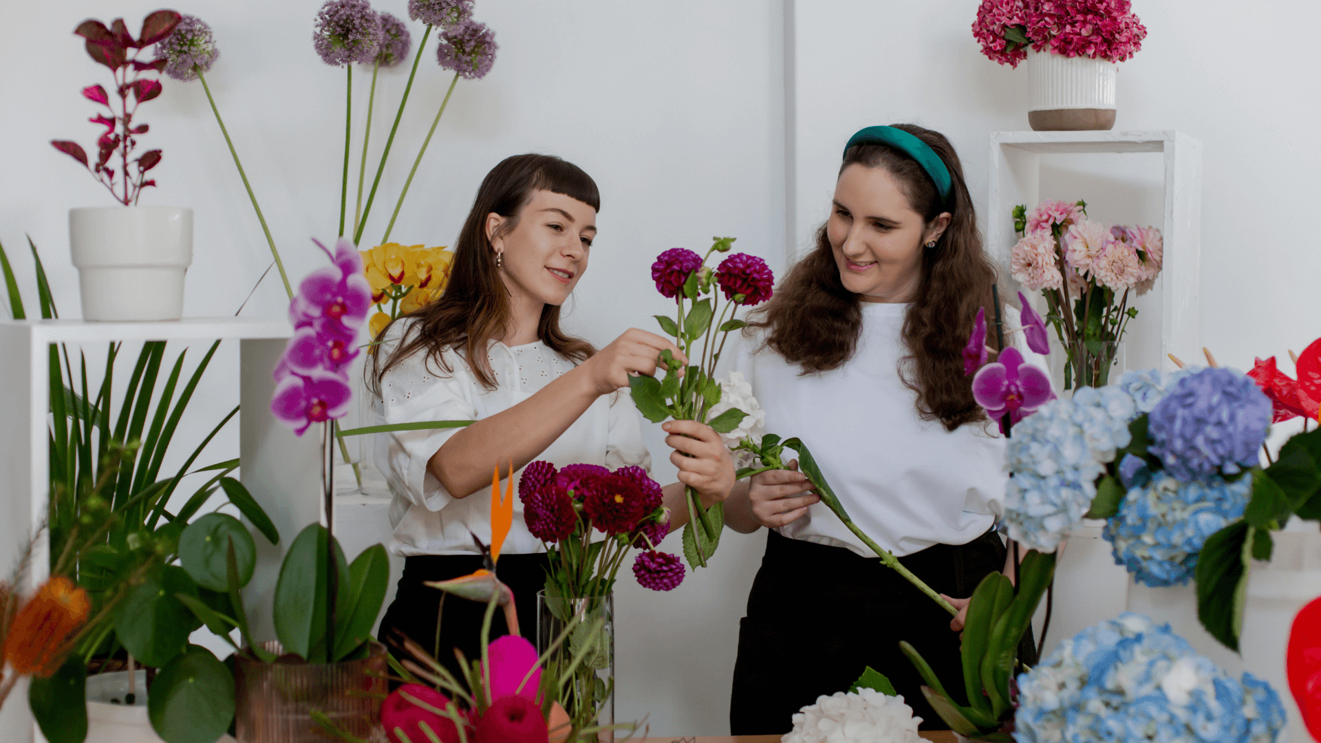 florists working together on vibrant floral arrangements