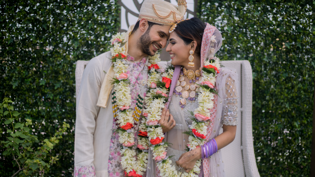 multi cultural wedding with traditional attire and floral garlands