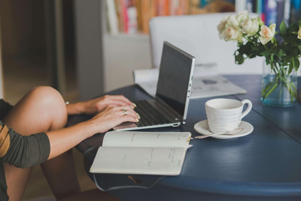 woman working from home on computer for wedding business