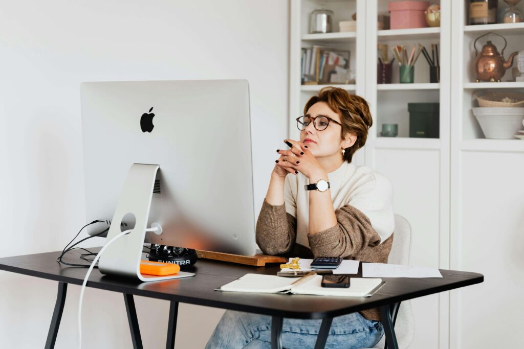 woman business owner sitting working on systems