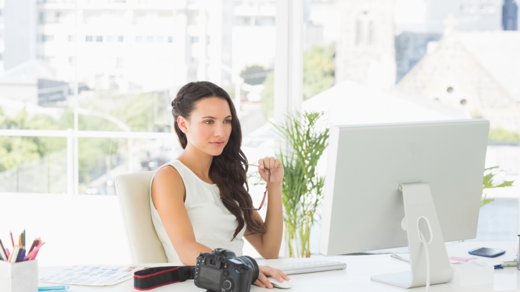 wedding photographer sitting at a computer working