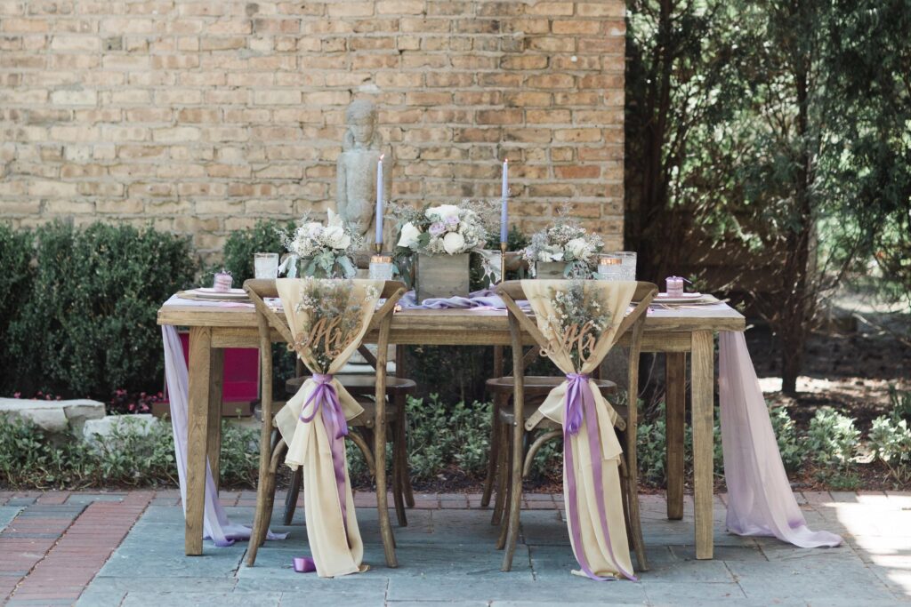 Wedding styeld shoot of a rustic purple wedding tablescape for intimate reception