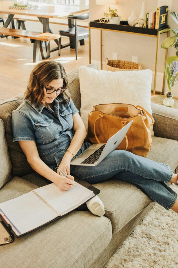 working women owned business on laptop looking at wedding business sales for the 2025 wedding season