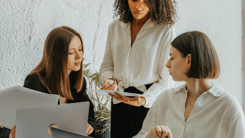 Marketing Systems Architect collaborating with a business owner and Online Business Manager to improve marketing systems and workflows.