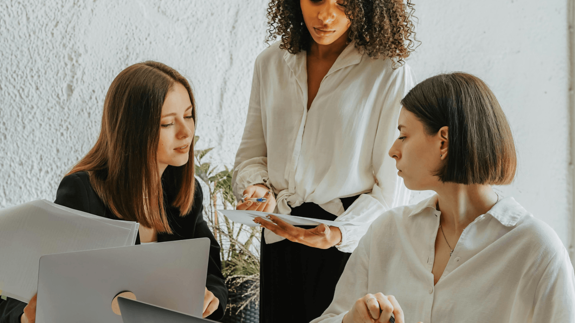 Marketing Systems Architect collaborating with a business owner and Online Business Manager to improve marketing systems and workflows.