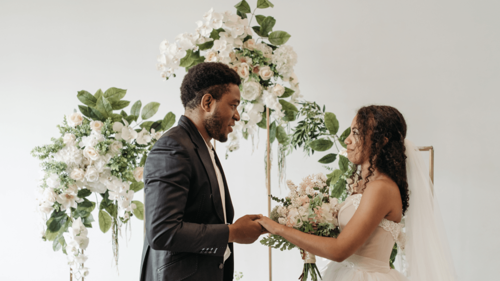 Bride and groom exchanging vows at a wedding ceremony.