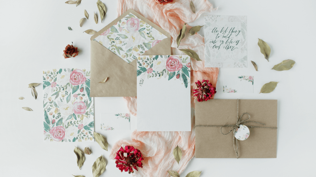 Flat lay of floral wedding stationery used for Pinterest content inspiration