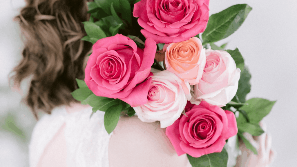 Close-up of pink and peach roses for Gen Z wedding floral design