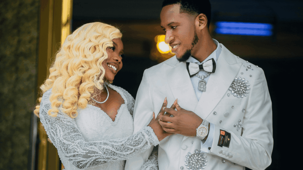 Portrait of a Black bride and groom in a beaded gown, representing beauty, confidence, and inclusion in wedding PR and media storytelling.