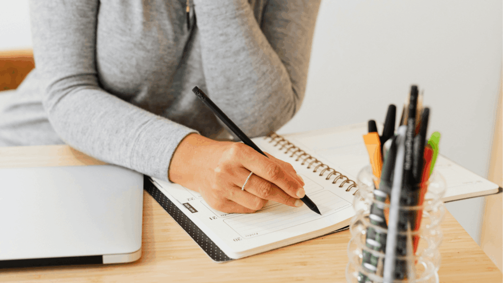 A photographer planning a marketing systems audit with a checklist with tools and setup process for creative business owners, improving their marketing workflows.