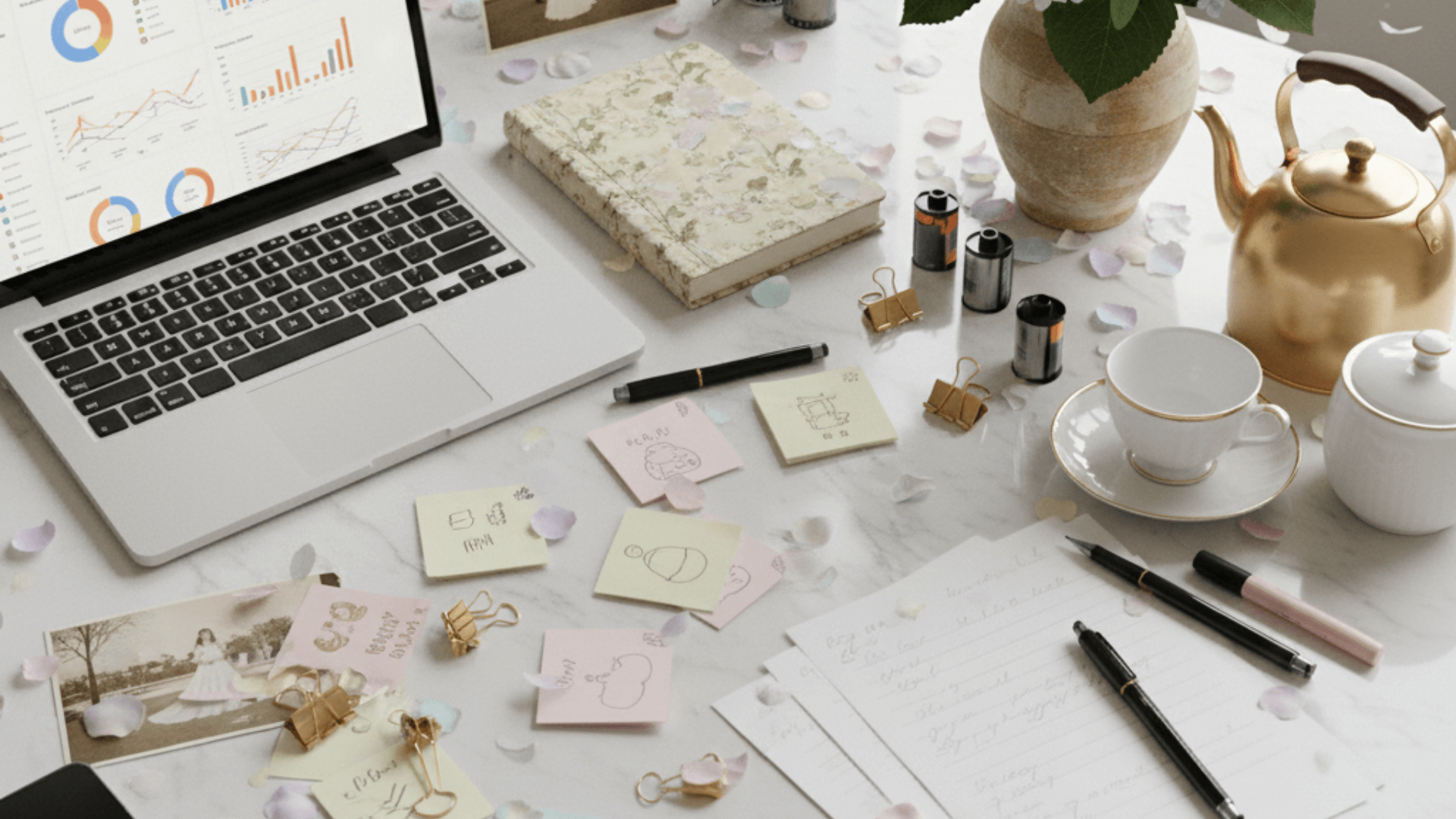 “Wedding professional reviewing marketing data and analytics on a laptop to improve systems and get consistent leads.