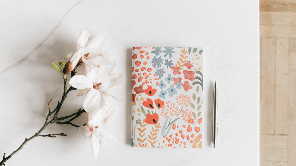 Journal, pen, and paper goods representing an independent stationery shop